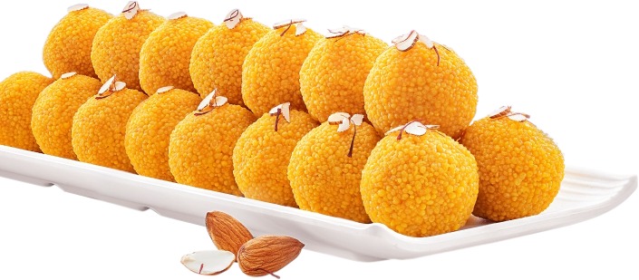 Motichoor Ladoos glistening in pure ghee in brass bowl